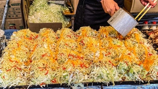 japanese street food - hiroshima style okonomiyaki   ( hiroshimayaki )