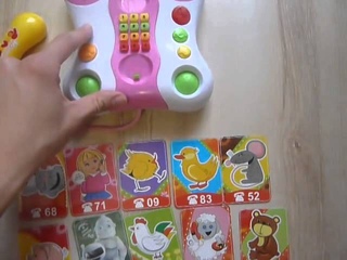Видео обзор - детская игрушка музыкальный телефон каталка Zhorya